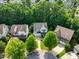Aerial view of the home and neighborhood showcasing the lush greenery at 108 Market Cross Ct, Holly Springs, NC 27540