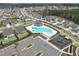 Community pool with seating and playground as seen from above with parking and nearby houses at 108 Market Cross Ct, Holly Springs, NC 27540