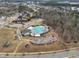 An aerial view of neighborhood pool and playground provides a nice outdoor recreation space for residents at 108 Market Cross Ct, Holly Springs, NC 27540