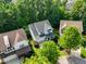 Aerial view of the neighborhood showcasing the homes and lush greenery at 108 Market Cross Ct, Holly Springs, NC 27540