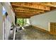 Spacious outdoor area under the deck showing access to the backyard and house at 108 Market Cross Ct, Holly Springs, NC 27540
