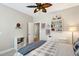 Bedroom featuring a ceiling fan, trophy display, and a cozy plaid blanket, perfect for a sports enthusiast at 108 Market Cross Ct, Holly Springs, NC 27540