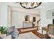 Inviting foyer with hardwood floors, decorative console, and stylish mirror creates a warm welcome at 108 Market Cross Ct, Holly Springs, NC 27540