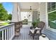 Charming porch with rocking chair, offering a relaxing outdoor space to enjoy the views at 108 Market Cross Ct, Holly Springs, NC 27540