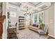 Well-lit office with coffered ceilings, large windows, and stylish decor creates a welcoming workspace at 108 Market Cross Ct, Holly Springs, NC 27540