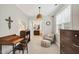 Bright office with desk, chair, and ottoman for a great work-from-home space at 108 Market Cross Ct, Holly Springs, NC 27540