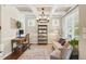 Stylish home office featuring a coffered ceiling, modern lighting, and ample workspace at 108 Market Cross Ct, Holly Springs, NC 27540