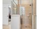 Walk-in shower featuring marble design and convenient access to the main bedroom at 108 Market Cross Ct, Holly Springs, NC 27540