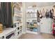 Spacious walk-in closet with built-in shelving for maximum storage and organization at 108 Market Cross Ct, Holly Springs, NC 27540