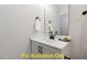 Bathroom featuring quartz countertops, black hardware, and contemporary fixtures at 110 Broadleaf Ln, Louisburg, NC 27549