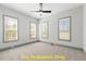Bright bedroom with neutral carpet, ceiling fan, and many windows providing natural light at 110 Broadleaf Ln, Louisburg, NC 27549