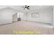 Spacious bonus room offering neutral carpet, lots of light, and gray trim at 110 Broadleaf Ln, Louisburg, NC 27549