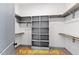 Walk-in closet with built-in shelves and wooden rods for ample storage at 110 Broadleaf Ln, Louisburg, NC 27549