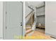 Welcoming entryway area leading to stairs, built in shelves and seating with storage at 110 Broadleaf Ln, Louisburg, NC 27549