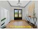 Elegant foyer with hardwood floors, decorative lighting, double doors, and neutral paint at 110 Broadleaf Ln, Louisburg, NC 27549