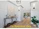 Stylish foyer showcasing hardwood floors, neutral walls, decorative lighting and an accent table at 110 Broadleaf Ln, Louisburg, NC 27549