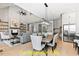 Open concept living room with a dining area, a stone fireplace, and hardwood floors at 110 Broadleaf Ln, Louisburg, NC 27549