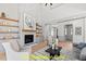 Cozy living room featuring a stone fireplace and open shelving at 110 Broadleaf Ln, Louisburg, NC 27549