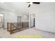 Upstairs loft area featuring carpet, a railing and access to other rooms and bathroom at 110 Broadleaf Ln, Louisburg, NC 27549