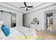 Bright main bedroom with a barn door leading to ensuite at 110 Broadleaf Ln, Louisburg, NC 27549