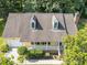 Overhead view of yellow home, showing the detailed roof, dormer windows, and landscaped front yard at 11901 N North Exeter Way Way, Raleigh, NC 27613