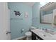 Bathroom with blue walls, tile flooring, and a single sink vanity at 11901 N North Exeter Way Way, Raleigh, NC 27613