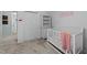 Bedroom featuring white walls, carpet, white shelving, and a white crib at 11901 N North Exeter Way Way, Raleigh, NC 27613