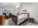 Bedroom with carpet, ceiling fan, desk, wood furniture, and neutral walls at 11901 N North Exeter Way Way, Raleigh, NC 27613