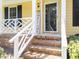 Home's entryway showcasing brick steps and a 