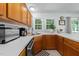 Bright kitchen featuring wooden cabinets, stainless steel appliances, and a breakfast nook at 11901 N North Exeter Way Way, Raleigh, NC 27613