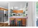 Cozy kitchenette with butcher block counter and barstools adjacent to dining area at 11901 N North Exeter Way Way, Raleigh, NC 27613