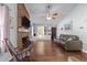 Cozy living room features a brick fireplace, built-in bookshelves, and comfortable seating at 11901 N North Exeter Way Way, Raleigh, NC 27613