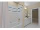 Bathroom featuring a shower/tub combo, and single sink vanity with gold hardware at 12201 Lockhart Ln, Raleigh, NC 27614