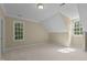 Neutral bedroom features natural light from two bright windows with ample space at 12201 Lockhart Ln, Raleigh, NC 27614