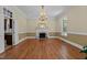 Elegant dining room with hardwood floors, a decorative chandelier, and lots of light at 12201 Lockhart Ln, Raleigh, NC 27614