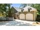 Stunning home exterior featuring a two-car garage, white trim, and manicured landscaping at 12201 Lockhart Ln, Raleigh, NC 27614