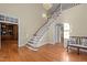 Elegant foyer with hardwood floors and grand staircase at 12201 Lockhart Ln, Raleigh, NC 27614