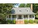 Charming home with large front porch and landscaped yard at 12201 Lockhart Ln, Raleigh, NC 27614