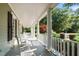 Relaxing front porch with rocking chairs at 12201 Lockhart Ln, Raleigh, NC 27614