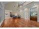 Spacious living room features hardwood floors, a wet bar, and lots of natural light at 12201 Lockhart Ln, Raleigh, NC 27614