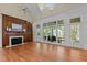 Bright living room featuring large windows and fireplace at 12201 Lockhart Ln, Raleigh, NC 27614