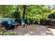 Charming outdoor patio featuring brick pavers, patio furniture, and a fire pit at 12201 Lockhart Ln, Raleigh, NC 27614