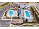 Aerial view of the community amenities including pools, playground, and clubhouse at 124 Seagraves Creek Ln, Holly Springs, NC 27540