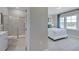 Bathroom with a tiled shower, vanity, and view into the bedroom at 124 Seagraves Creek Ln, Holly Springs, NC 27540