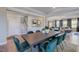 Open-concept dining area with seamless transition to living spaces and a staircase at 124 Seagraves Creek Ln, Holly Springs, NC 27540