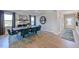 Spacious dining area with a table, seating, and a view to the entry hall at 124 Seagraves Creek Ln, Holly Springs, NC 27540