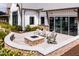 Outdoor patio with stone fire pit and seating area by the community pool at 124 Seagraves Creek Ln, Holly Springs, NC 27540