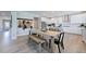 Bright eat-in kitchen with white cabinets, stainless steel appliances, and a large island at 124 Seagraves Creek Ln, Holly Springs, NC 27540