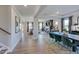 Open-concept living and dining area with hardwood floors and ample natural light at 124 Seagraves Creek Ln, Holly Springs, NC 27540
