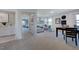 This living room is bright with a cozy couch and a home office area at 124 Seagraves Creek Ln, Holly Springs, NC 27540